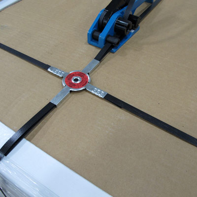 Tensioning perpendicular strapping